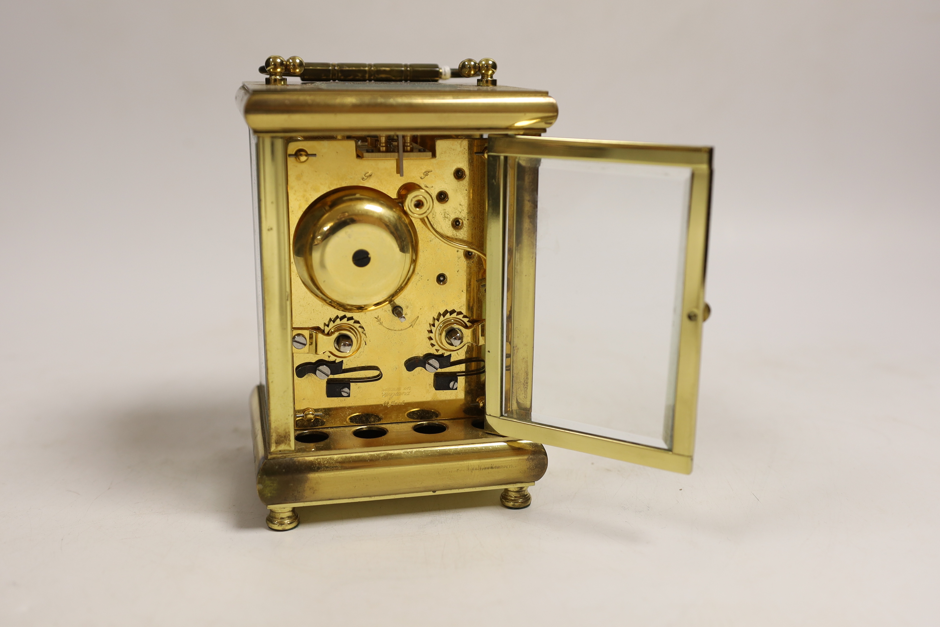 A 20th century brass carriage clock, signed Taylor and Bligh, England, striking on a bell 14cm high